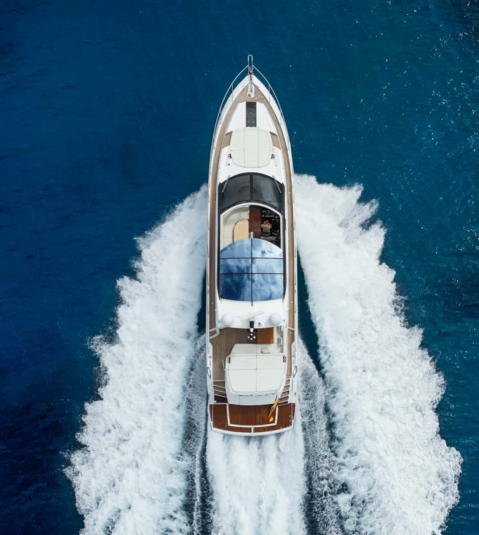 Yacht cutting through blue water